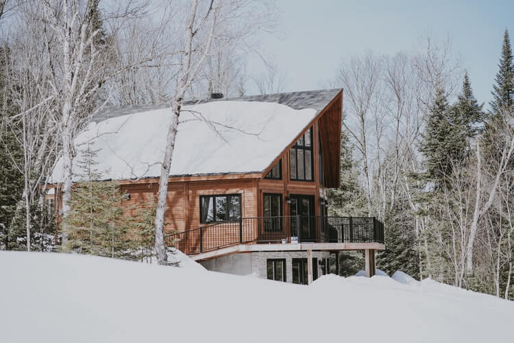 A two story home covered in snow